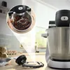 A kitchen scene with a stand mixer in use and a close-up of its attachments. Produktbild-Vorschau