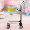 A toy shopping cart is shown in a child's room with toys and storage boxes in the background. Produktbild-Vorschau