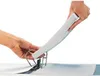 Hands are shown inserting papers into a green binder. Náhled obrázku produktu