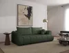 A modern living room with a green sofa, abstract art, and a floor lamp. Produktbild-Vorschau