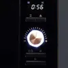 A close-up view of the control panel of a black microwave oven. Anteprima dell’immagine prodotto