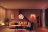 A modern living room with a sofa, chair, and decorative lighting. Náhled obrázku produktu