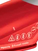 A close-up view of the top of a red Russell Hobbs iron, showing various steam settings and the brand name. Produktbild-Vorschau