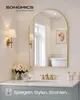 A bathroom vanity with a large arched mirror, sink, faucet, and a bouquet of flowers. Náhled obrázku produktu