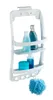 A white shower caddy with bathroom products and a pouf. Produktbild-Vorschau