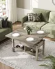 A living room scene with a couch and a coffee table set for a meal. Voir les images du produit