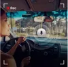 A woman driving a car, with a dashcam visible on the windshield. Voir les images du produit