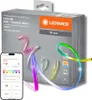 A product box for an LED strip light, with the product itself partially visible and a smartphone displaying the control app. Podgląd zdjęcia produktu