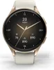 A close-up, front-facing view of a smartwatch with a gold bezel and a white strap, displayed on a white background. Voir les images du produit