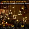 Christmas lights with various festive shapes hanging indoors. Náhled obrázku produktu
