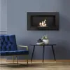 A modern living room setting with a blue armchair, a small side table with decorative items, and a black wall-mounted bioethanol fireplace with a flame. Náhled obrázku produktu
