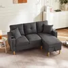 A dark gray sectional sofa in a living room. Podgląd zdjęcia produktu