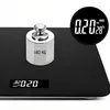 A chrome weight sits on a black digital scale. Voir les images du produit