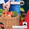 Hands holding a woven basket filled with fresh vegetables. Náhled obrázku produktu