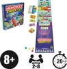 A flat lay of the Monopoly Knockout board game, including the box, game board, money, and game pieces. Voir les images du produit