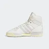A studio shot of a single white Adidas Rivalry Hi sneaker against a white background. Produktbild-Vorschau