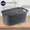 A grey laundry basket with dimensions indicated by text and arrows, placed on a wooden surface. Produktbild-Vorschau