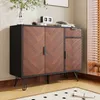 A wooden sideboard with black accents and legs, placed on a rug in a room with natural light coming from a window. Náhled obrázku produktu