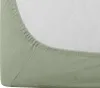 A close-up view of the corner of a light green fitted sheet, showing the elasticized edge. Anteprima dell’immagine prodotto