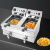 A commercial double-basket deep fryer filled with fried food, with a plate of french fries in the foreground. Voir les images du produit