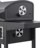 A close-up view of a charcoal grill, focusing on the vents and a side shelf. Podgląd zdjęcia produktu