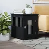 A black wooden dog crate is placed next to a yellow sofa, with a plant on the left and books and a cactus on top of the crate. Náhled obrázku produktu