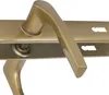 A close-up view of a gold-colored door handle set, showing the mechanism and keyhole slots. Anteprima dell’immagine prodotto