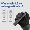 A hand wearing a glove holds a black flashlight, with feature callouts in the background. Podgląd zdjęcia produktu