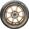 A close-up studio shot of a Toyo Proxes R888R tire mounted on a bronze multi-spoke wheel, presented against a plain white background. Podgląd zdjęcia produktu