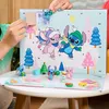 A close-up shot of an open advent calendar with Stitch-themed figures and decorations. Produktbild-Vorschau