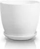 A white ceramic plant pot with a matching saucer, presented on a reflective white surface. Podgląd zdjęcia produktu