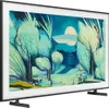 A Samsung QLED The Frame TV displaying a colorful landscape painting, with its stand visible. Voir les images du produit