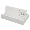 A white plastic stand for a handheld gaming device, shown from a slightly elevated side angle on a white background. Produktbild-Vorschau