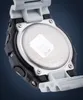 Close-up of the back of a Casio G-Shock watch, showing the metal case back with engraved text and a sticker. Podgląd zdjęcia produktu