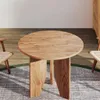 A round wooden table with two chairs in a room with wooden flooring and a rug. Náhled obrázku produktu