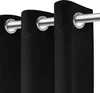 Close-up of black curtains with grommets on a silver curtain rod. Podgląd zdjęcia produktu