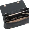 The image shows the inside of a black Guess handbag. Produktbild-Vorschau