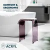 A modern bathroom setting with a bathtub, vanity, and a transparent mauve acrylic stool. Anteprima dell’immagine prodotto