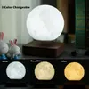 A collage showing a levitating moon lamp in different color settings, with decorative bunnies and books in the background. Náhled obrázku produktu