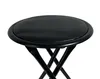 A close-up, eye-level view of a black folding stool against a white background. Anteprima dell’immagine prodotto