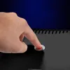 A hand is pressing a button on a black product. Náhled obrázku produktu