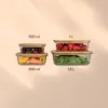 A set of glass food storage containers with bamboo lids, filled with various fruits and vegetables, arranged in two columns. Produktbild-Vorschau