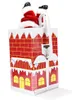 A Christmas decoration of Santa Claus climbing out of a chimney. Voir les images du produit