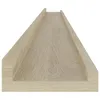 A close-up, angled view of a wooden shelf with a light oak finish, set against a white background. Anteprima dell’immagine prodotto