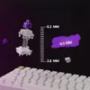 A disassembled keyboard switch is shown floating above a keyboard, with measurement indicators and a purple paint-like smudge. Anteprima dell’immagine prodotto