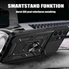 A black phone case with a ring stand is shown on a wooden surface, with a laptop and headphones in the background. Produktbild-Vorschau