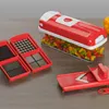 A kitchen counter with a vegetable chopper and chopped vegetables. Produktbild-Vorschau