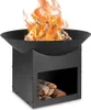 A black metal fire pit with a fire burning inside and firewood stored in the base. Anteprima dell’immagine prodotto