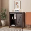 A dark brown buffet cabinet with sliding doors and shelves, decorated with a plant, books, and a calendar. Podgląd zdjęcia produktu