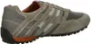 Side view of a single beige athletic shoe. Produktbild-Vorschau